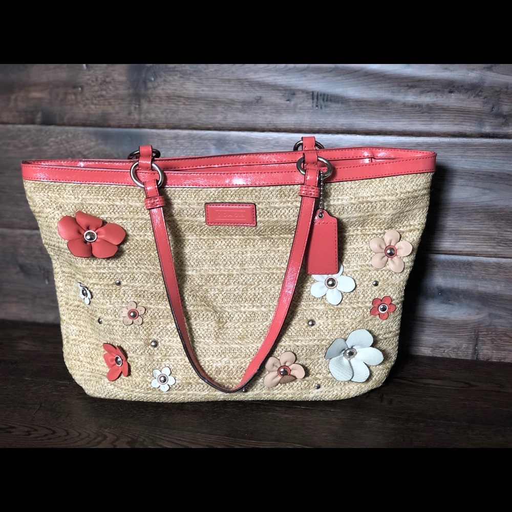 Coach pink flowers on a woven bag